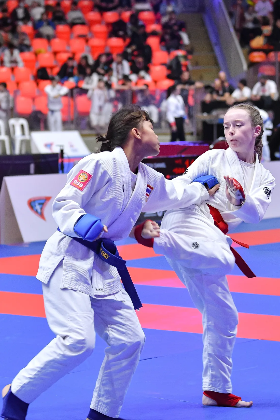 Two young Jujitsu athletes competing at a championship